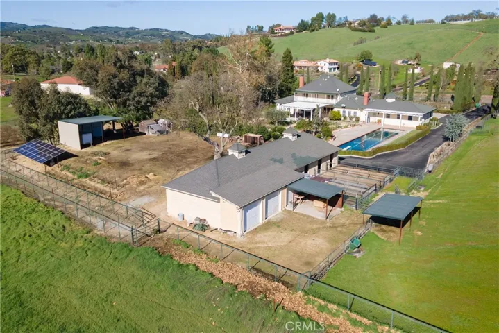 4 stall barn, tack room and 4 vehicle garage, trailer shed, solar, chicken house and more