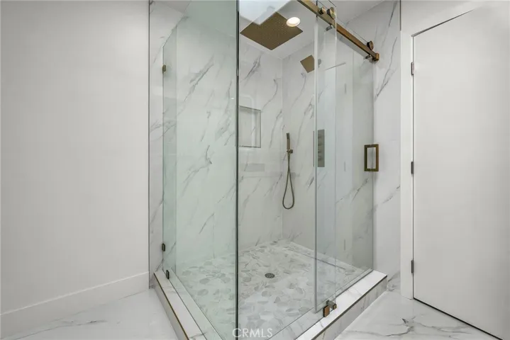 Second primary bath offers an expansive walk-in shower.
