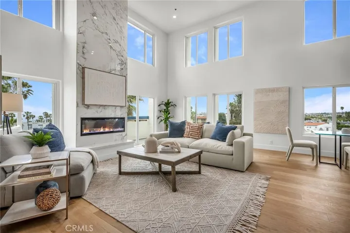 Picture-perfect living room featuring incredible views and a striking LED fireplace