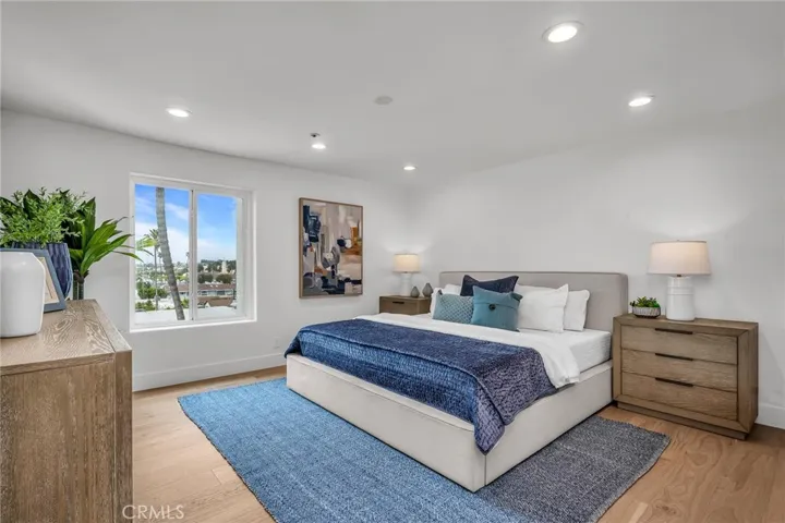 Elegant main-level bedroom featuring a private ensuite bath, offering comfort, convenience, and refined living.
