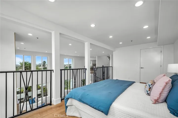 Loft-style guest room with a spacious walk-in closet, offering comfort and versatility.