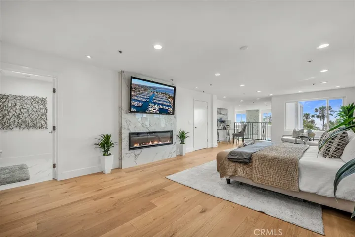 Spacious primary suite with stunning views, dual baths, a flexible retreat/work area, and wall-to-wall integrated system closets.