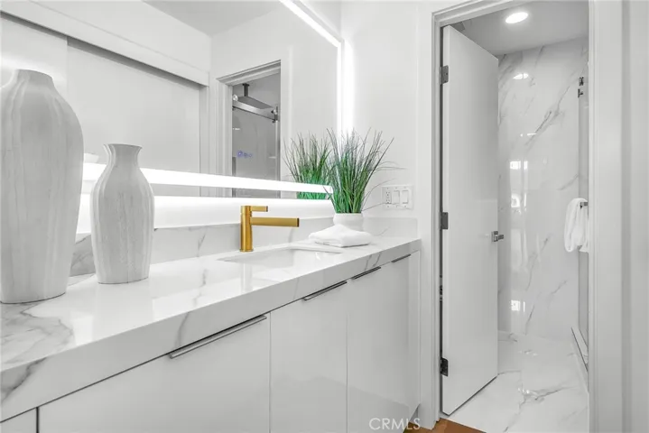 Luxurious bath on first level with walk-in shower