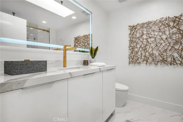 Beautifully upgraded primary bath showcasing luxury fixtures and contemporary design