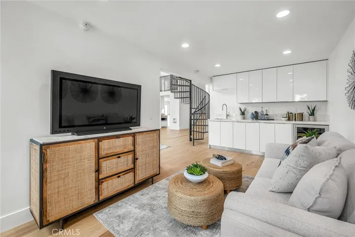Versatile flex space featuring a bar, perfect for entertaining, formal dining, or an additional living area.