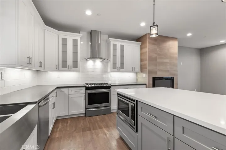 Kitchen. Built in microwave on center island.