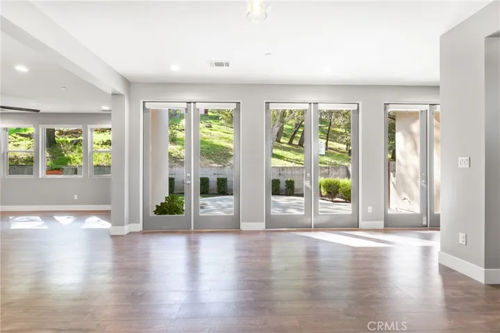 3 French doors facing backyard.