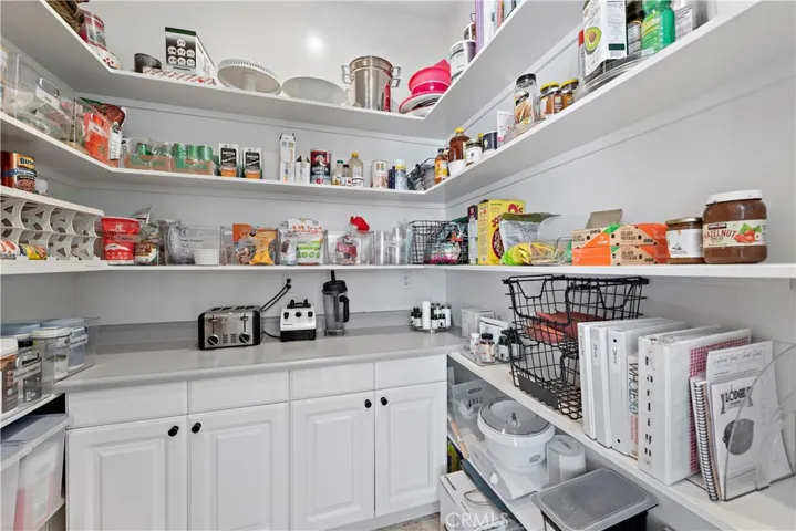 a huge very functional pantry that keeps your kitchen spotless and all that you do is right at your fingertips!