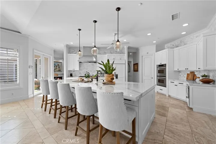A massive marble topped island sets the tone for gatherings that turns this great room into a stunning central gathering space designed for effortless entertaining and so many memorable moments!