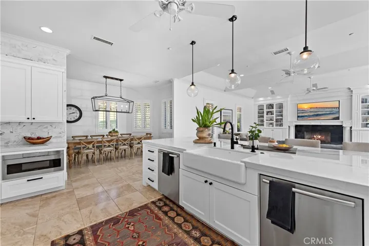 Notice dual dishwashers, large microwave drawer, loads of storage including a large walk in pantry off to the left right out of the picture and the dining area.