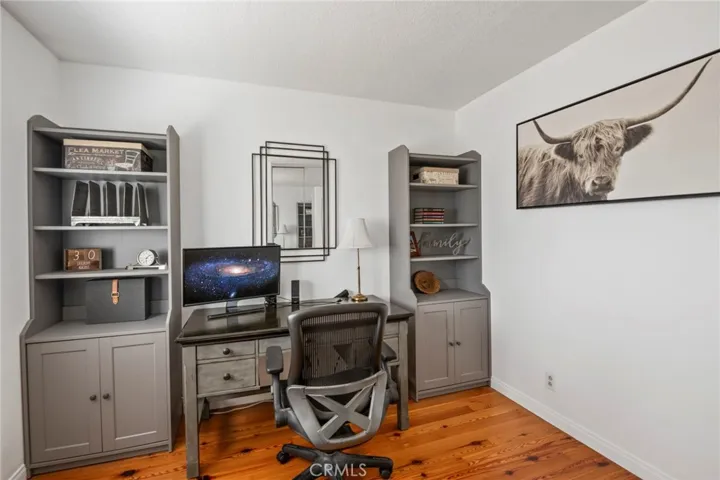 Middle bedroom 3 currently used as an office with built in shelves and cabinets can accomodate standard queen size mattress if desk is removed.