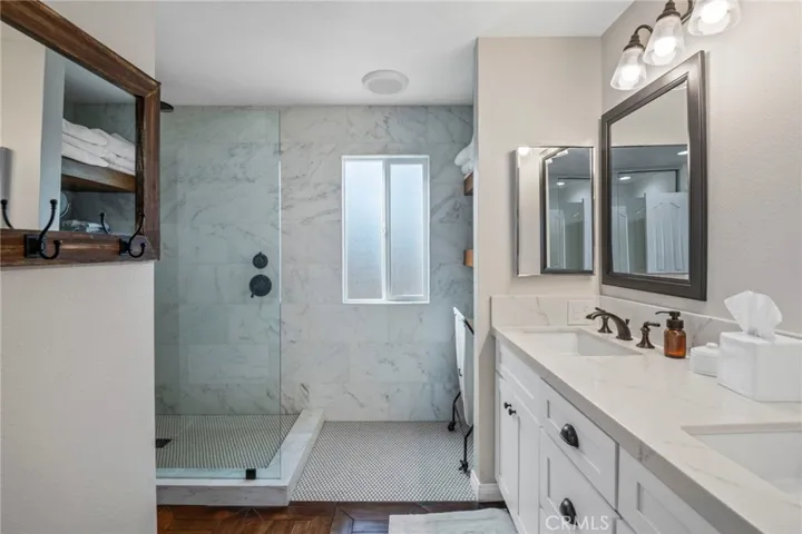 Updated Primary bathroom with dual sinks and quartz counters.