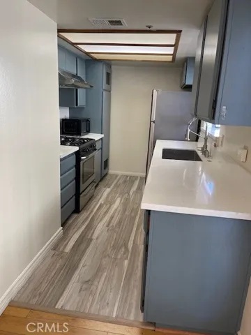 Kitchen with quartz countertop floor ceramic tiles