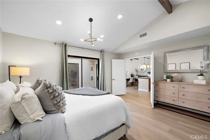 Primary suite with double door entry off living room and sliders to the atrium patio