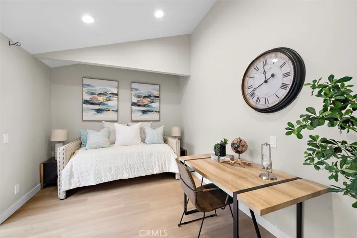 Bedroom #2 has vaulted ceiling, recessed lighting, wood vinyl flooring, and slider to atrium patio