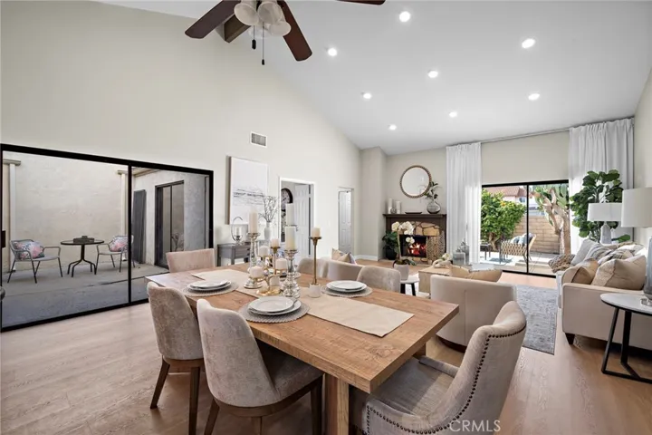 Formal dining area, living room, sliders to inside atrium patio, and large private patio