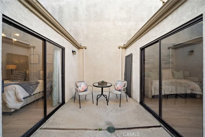 Sliders go from living room, primary suite and bedroom #2 to this private atrium patio