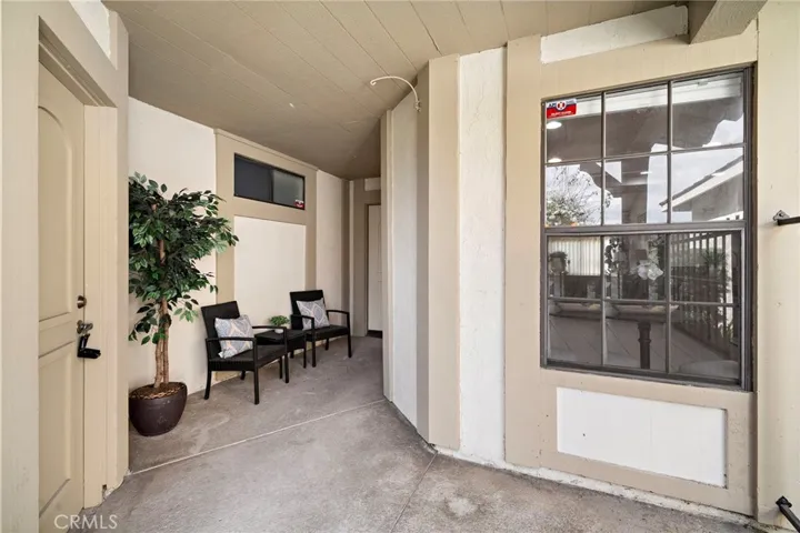 Gated courtyard entry. Door on left goes to 2 card garage