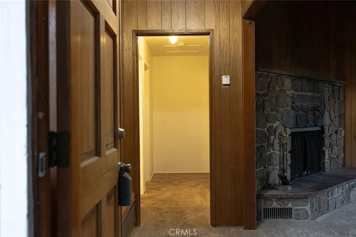 Main entry, living room & kitchen to the right and hallway leads to main bathroom & 2 bedrooms.