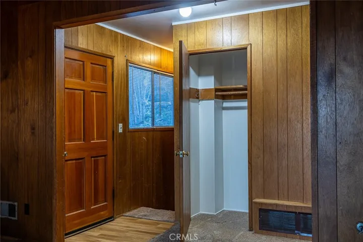 Entry door, Hall Closet and stairs that lead down stairs bedroom and more..