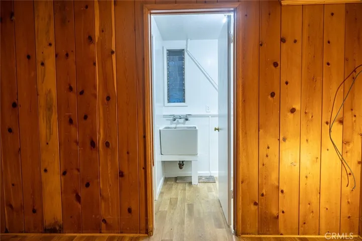 Laundry room next to 3/4 bathroom. Downstairs off