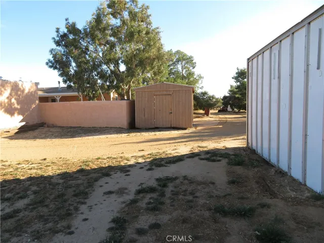 STORAGE SHED AND FENCED IN BACK YARD AREA