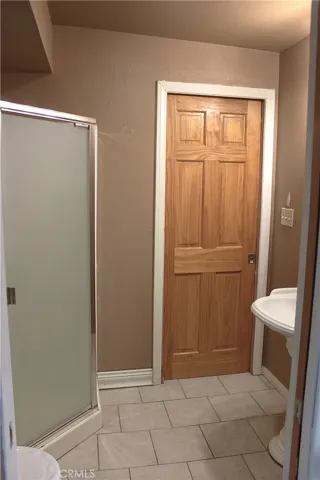 DOOR TO LIVING ROOM IN PRIMARY 2 BATHROOM JACK & JILL