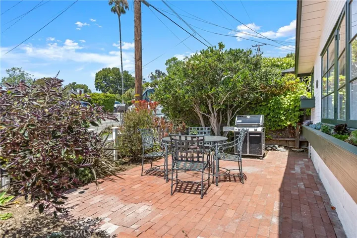 Front patio is lovely for relaxing, entertaining and watching the world go by.