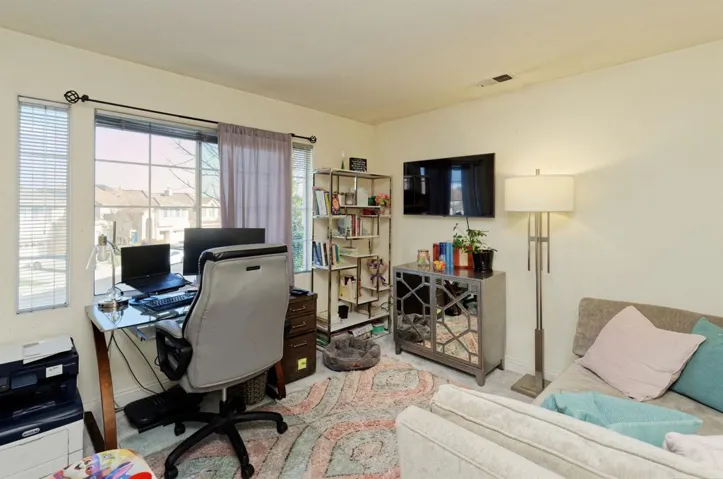 Carpeted office featuring baseboards