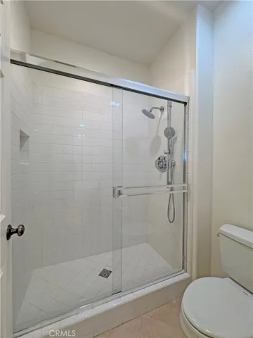 Main bathroom with huge walk-in shower, new fixtures and glass doors