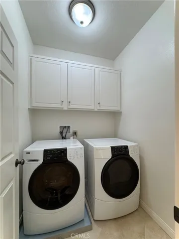 Laundry room with included washer and dryer