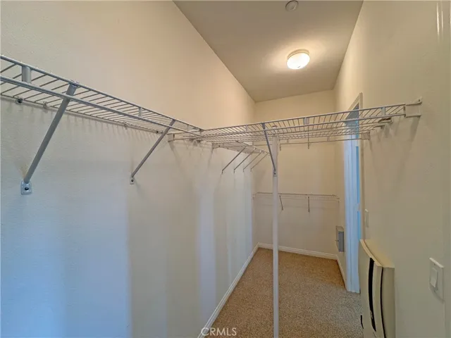Very large main closet accessed by two mirrored doors l