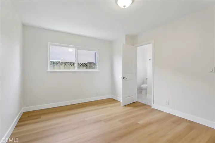 Primary bedroom and door to primary bathroom
