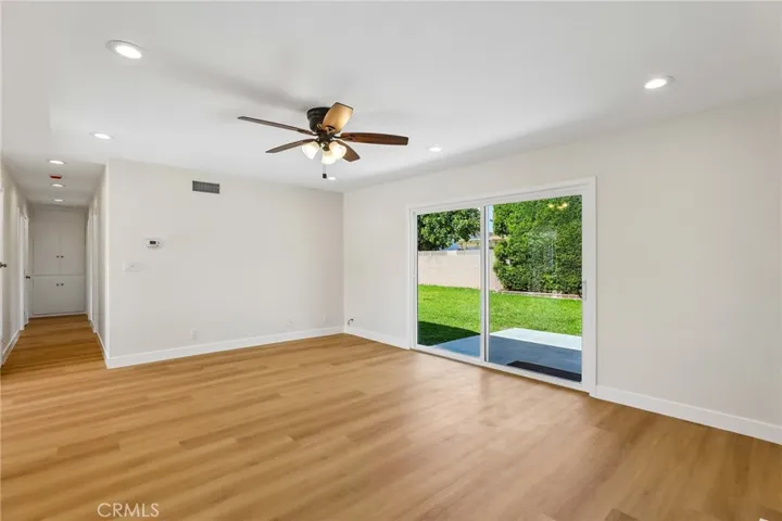 Living room with the fireplace behind viewer