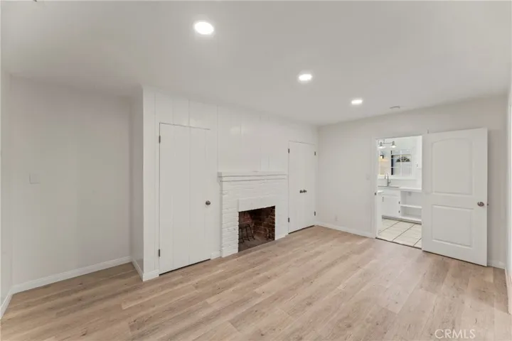Primary bedroom w/ fireplace