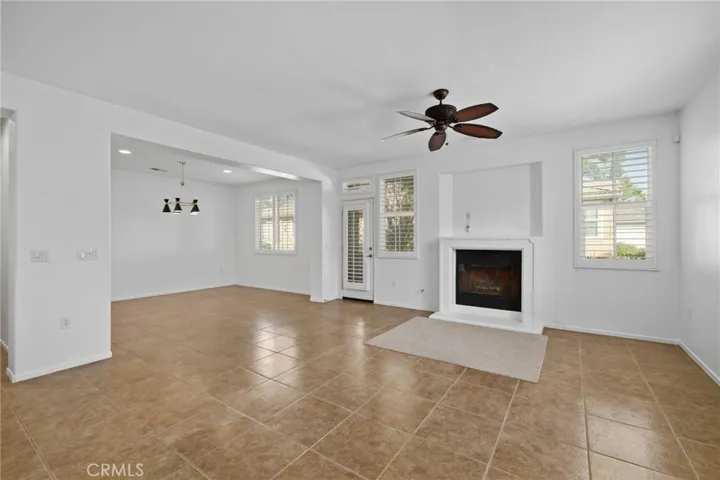 The home offers a open concept living room with a gas fireplace, dinning room, with access to its own private patio.