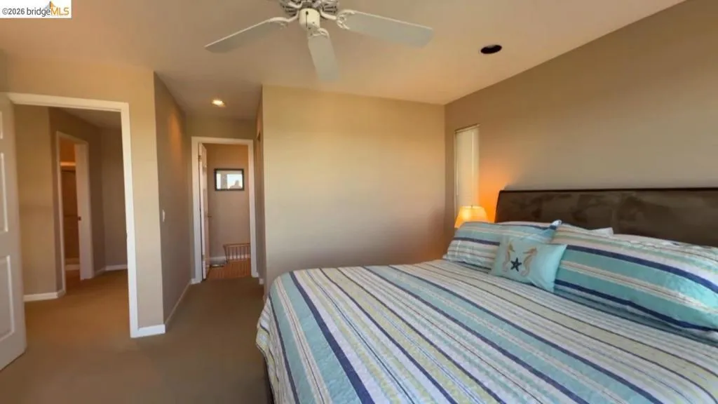 Bedroom with recessed lighting, ceiling fan, and carpet flooring