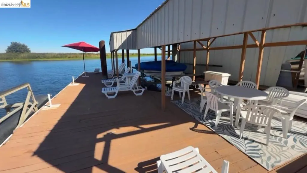 Dock featuring a water view