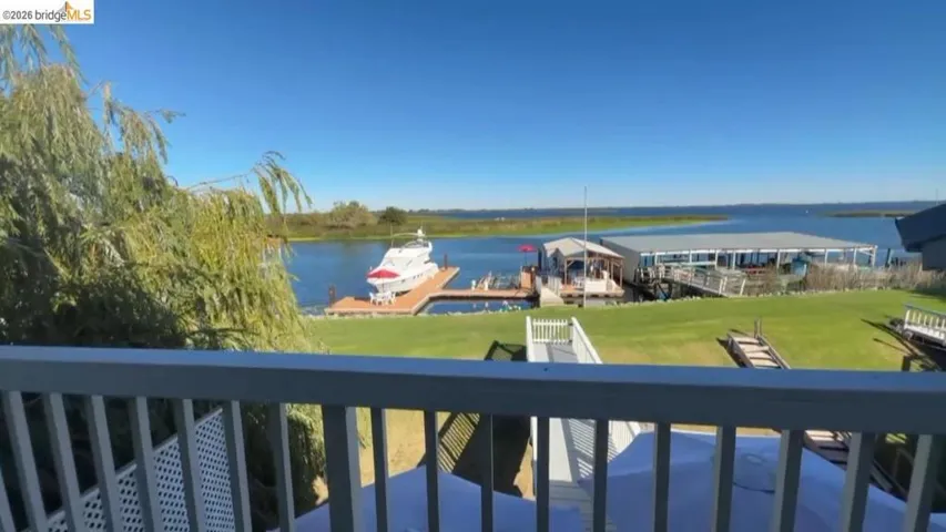 Water view featuring a dock and boat lift