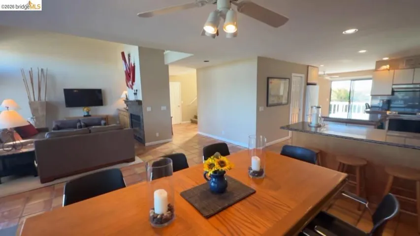 Dining room with recessed lighting and a ceiling fan