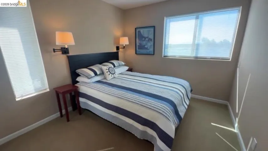 Bedroom with carpet floors and baseboards
