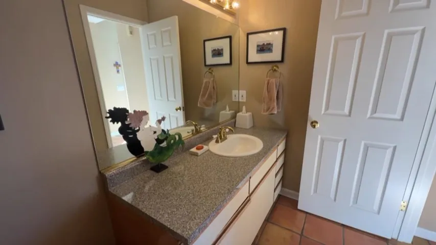 Bathroom with vanity and tile patterned floors