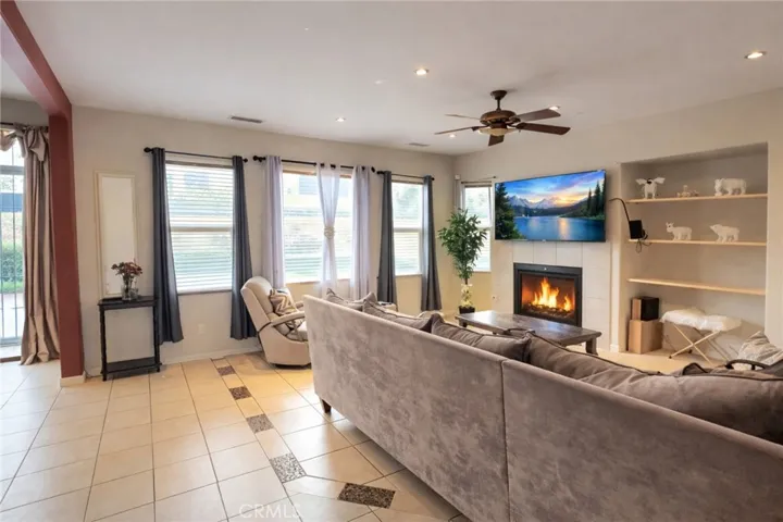 Fireplace flame and television imagery shown in photos are digitally enhanced.