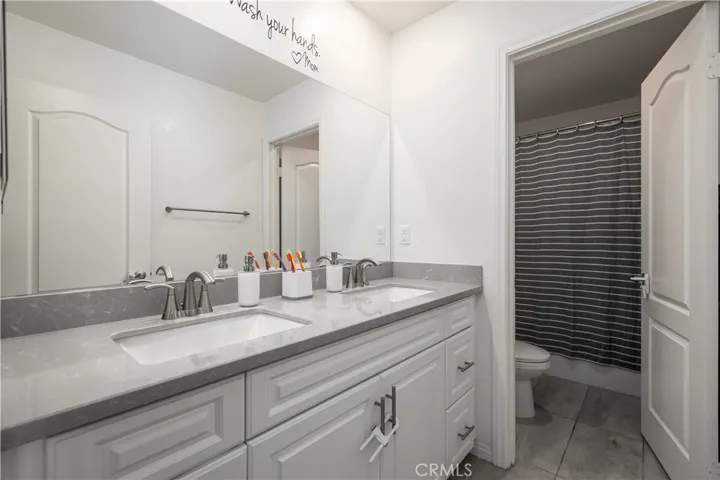 Additional full bath with dual sinks upstairs