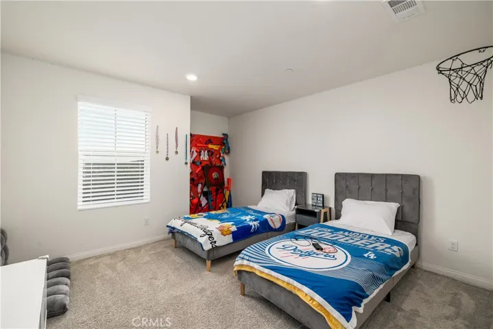 Fourth bedroom upstairs with walk in closet