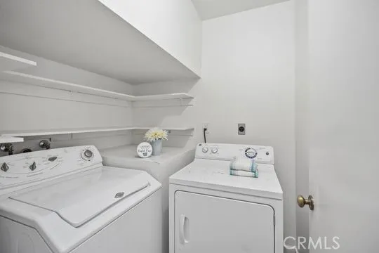 Inside Laundry room, w/ Washer and Dryer