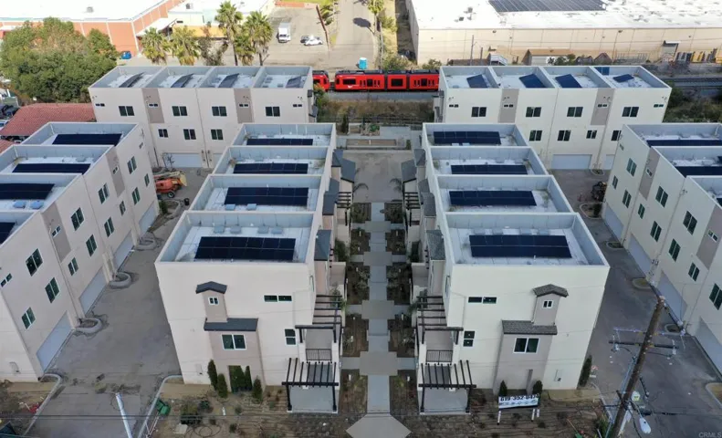 Aerial view of newly constructed residential community. Notice the trolley line in the background.
