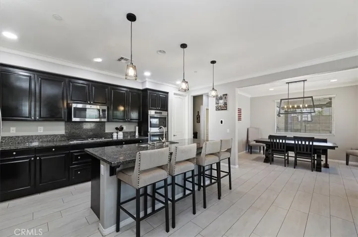 Kitchen seamlessly connects to the dining and family room