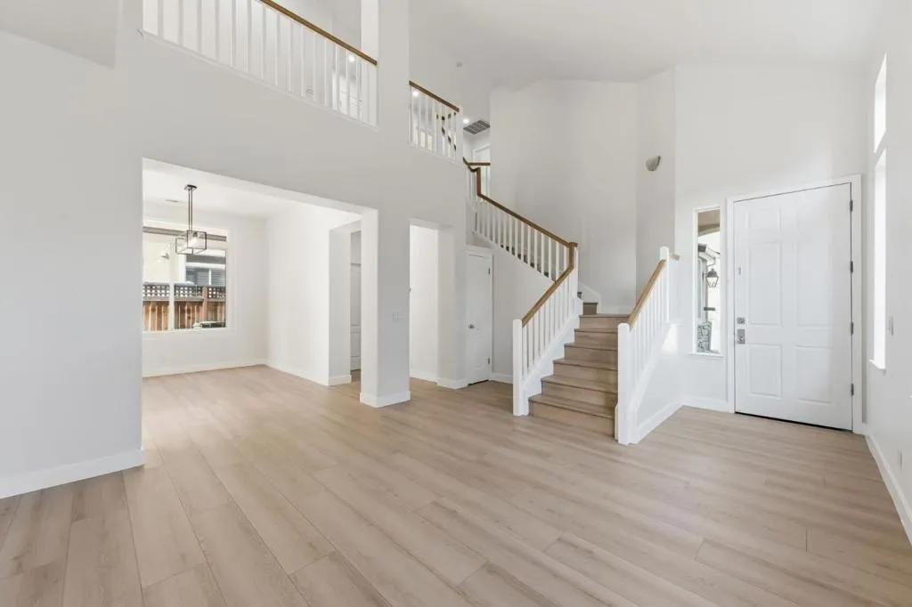 Main Living Room and Dining room. Coat closet, Half Bath and Laundry Room