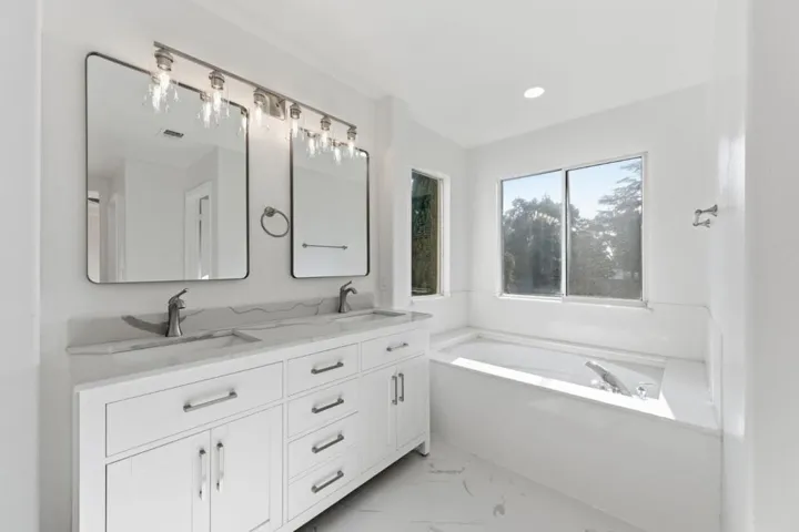 Primary Bathroom with soaking tub and dual vanities